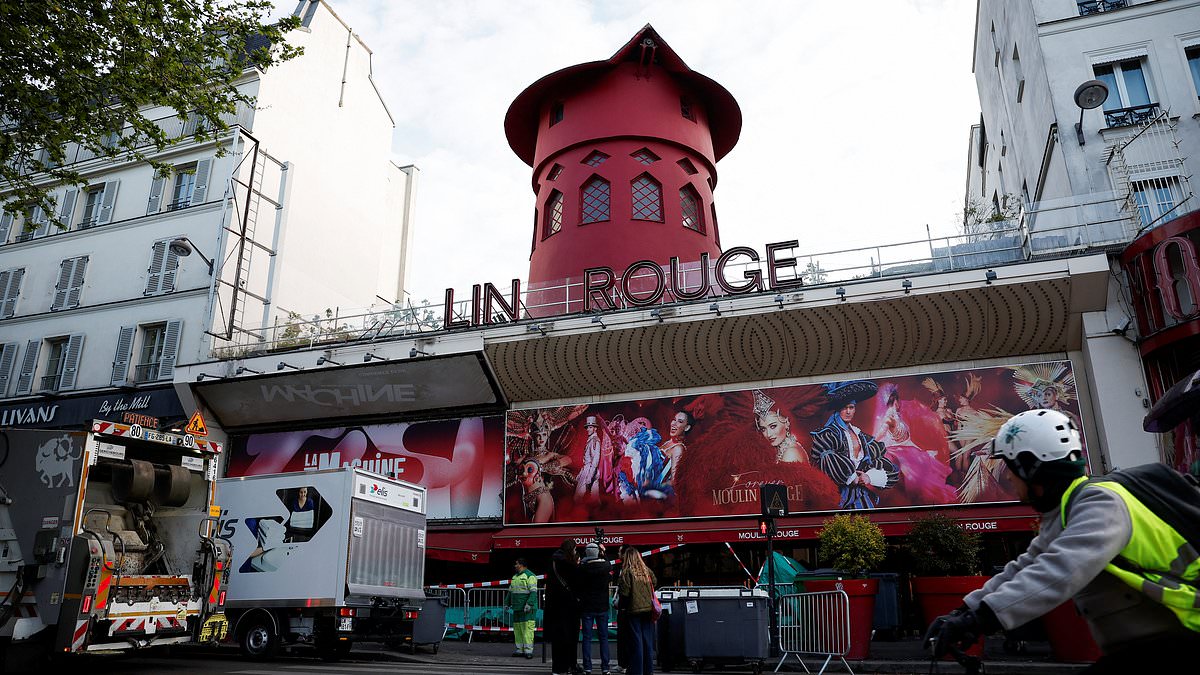 Moulin Rouge's world-famous windmill sails FALL OFF and crash onto the street outside the renowned Paris theatre
